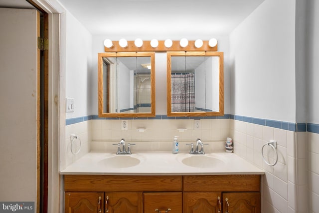 full bath featuring double vanity and a sink