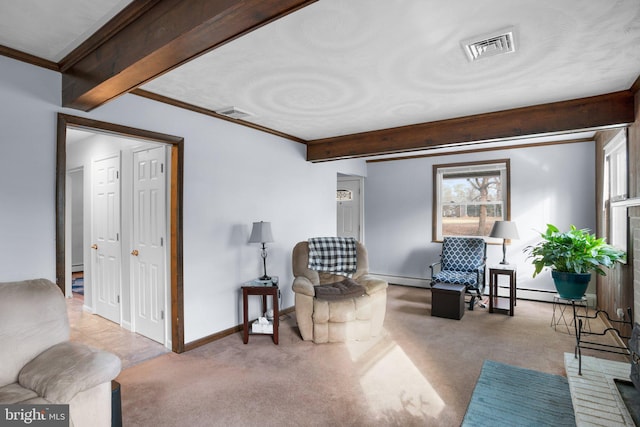 living area with light colored carpet, a baseboard heating unit, baseboards, ornamental molding, and beam ceiling