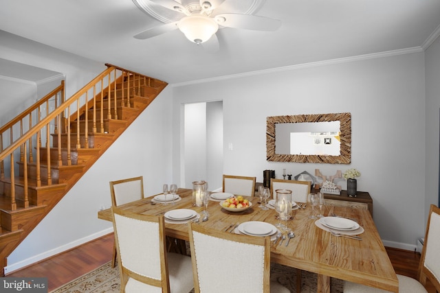 dining area with stairs, ceiling fan, wood finished floors, and baseboards