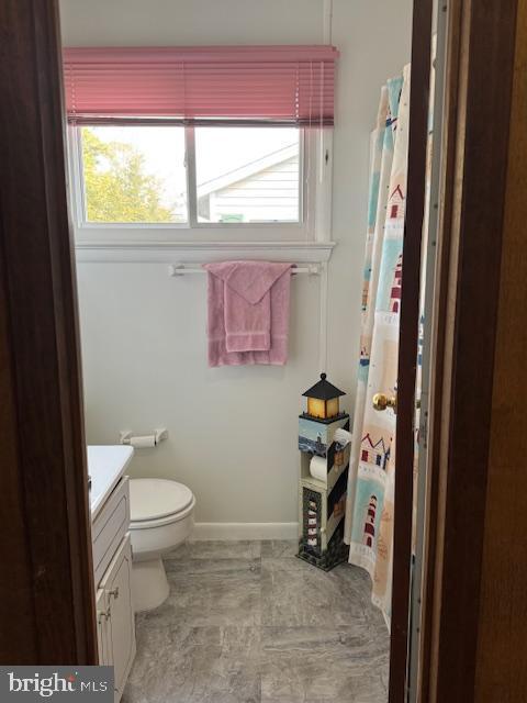 bathroom featuring vanity and toilet