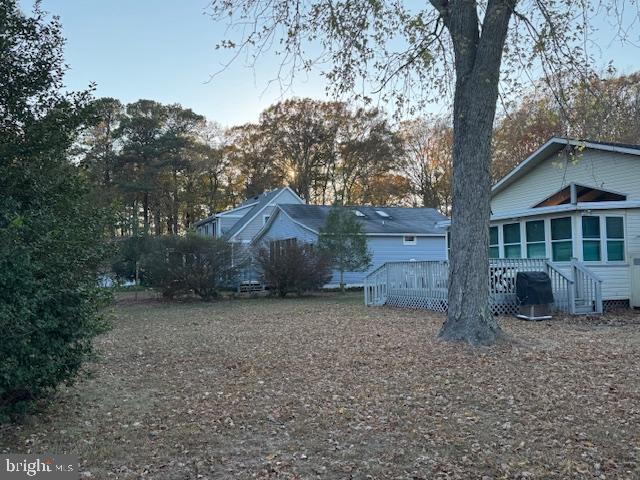 view of yard featuring a wooden deck