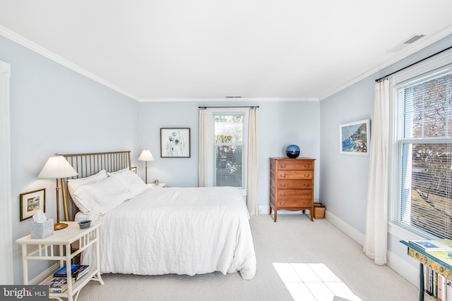 carpeted bedroom with ornamental molding