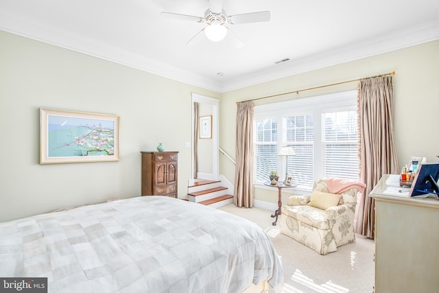 bedroom with light carpet, ornamental molding, and ceiling fan