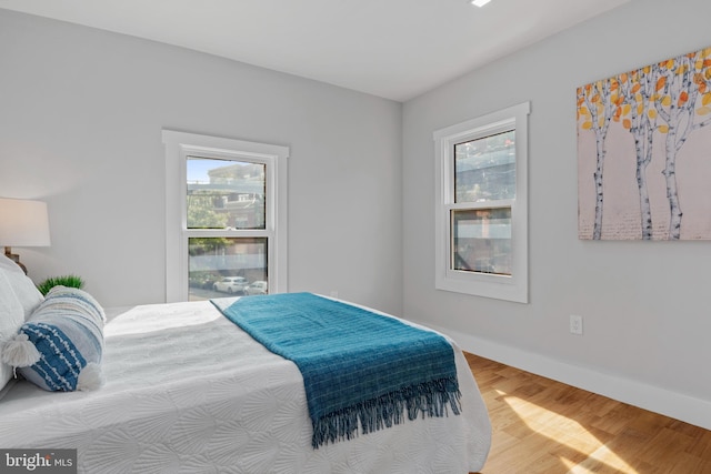 bedroom with hardwood / wood-style floors