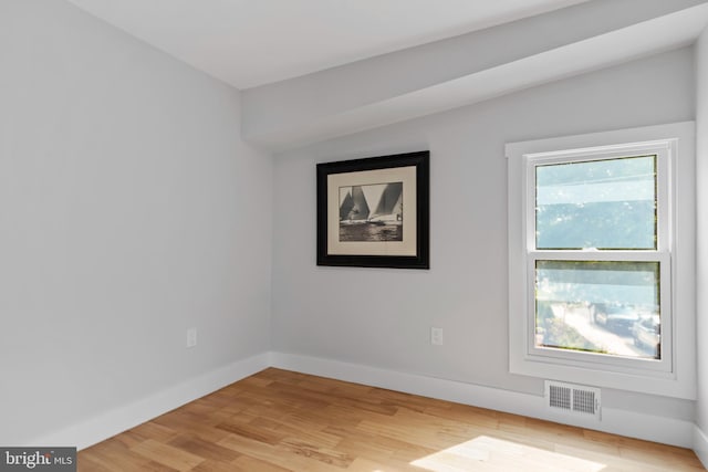 spare room featuring light wood-type flooring