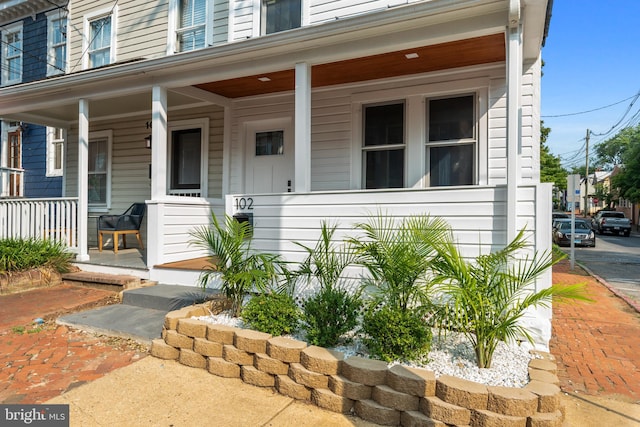 doorway to property featuring a porch