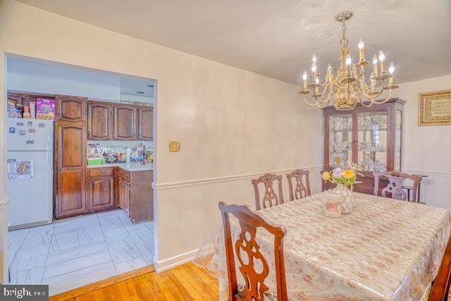 dining room with a chandelier