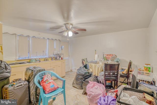 interior space featuring ceiling fan