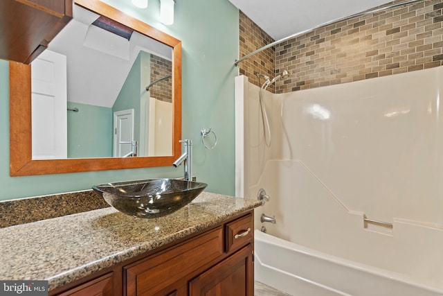 bathroom with vanity and shower / bath combination