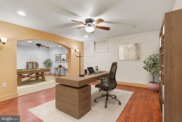 home office featuring hardwood / wood-style flooring, pool table, and ceiling fan