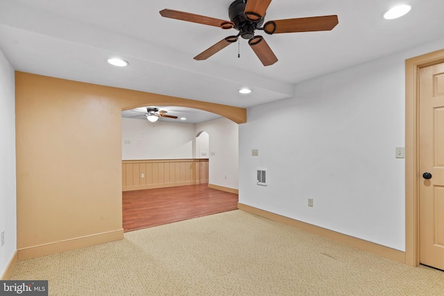 carpeted empty room with ceiling fan