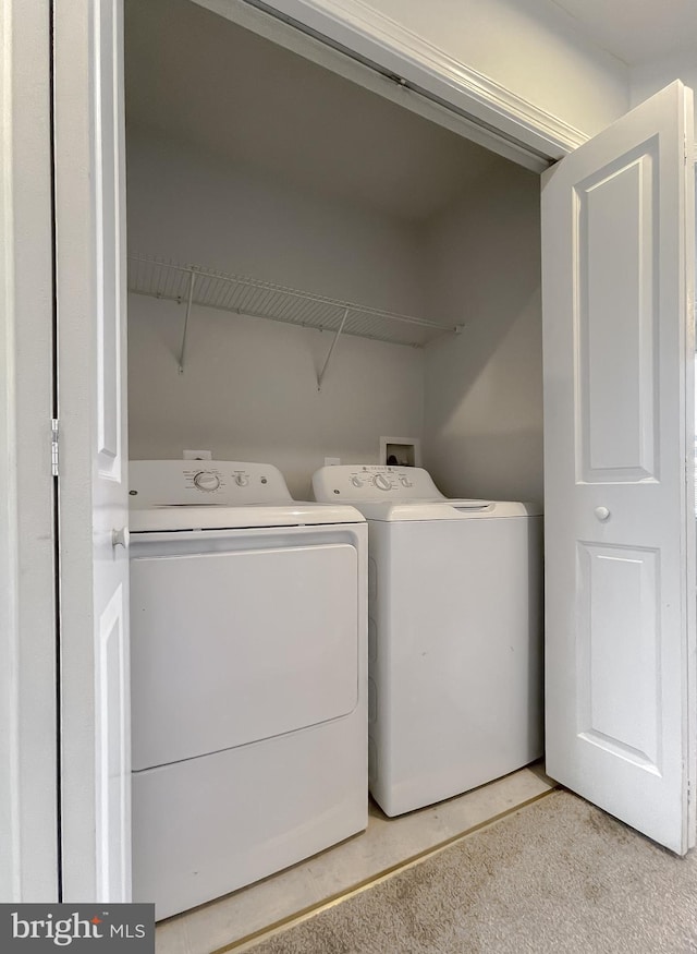 laundry room featuring laundry area and washer and clothes dryer