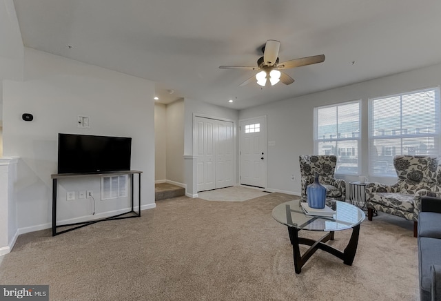 carpeted living area with ceiling fan, baseboards, and recessed lighting