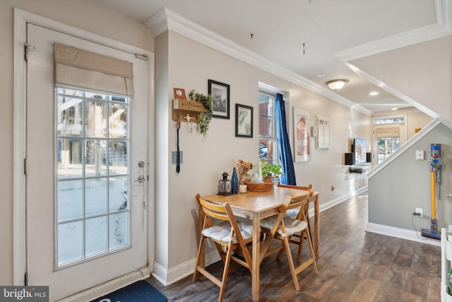 dining room with crown molding and dark wood-type flooring