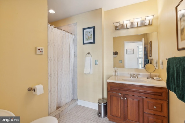 bathroom featuring tile patterned floors, toilet, vanity, and curtained shower