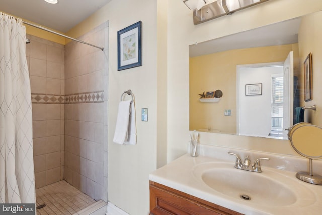 bathroom featuring a shower with curtain and vanity