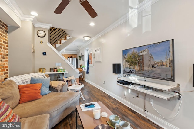 living room featuring ceiling fan, crown molding, and dark hardwood / wood-style flooring