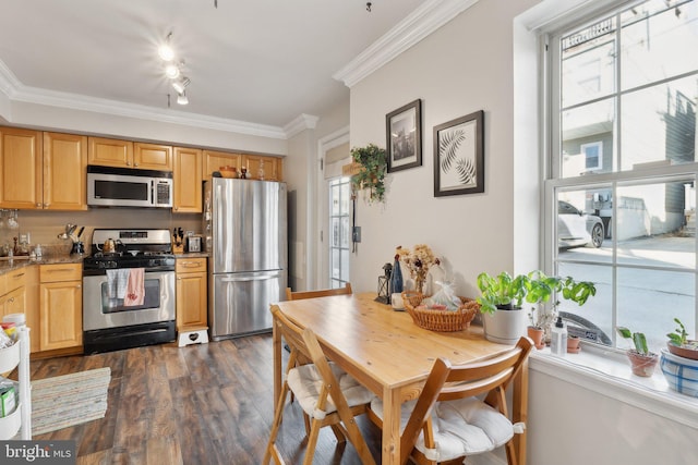 kitchen with stainless steel appliances, dark wood-type flooring, light brown cabinets, light stone countertops, and ornamental molding