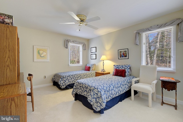 bedroom featuring light carpet and ceiling fan