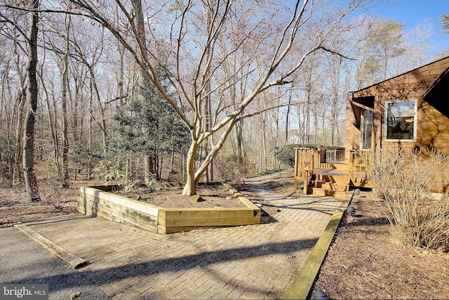 view of yard featuring a wooden deck