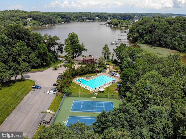 birds eye view of property with a water view