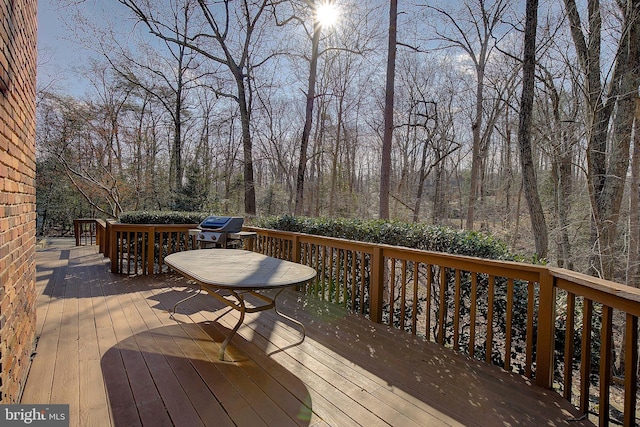 wooden deck with grilling area