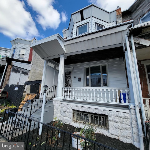 view of front of property featuring covered porch