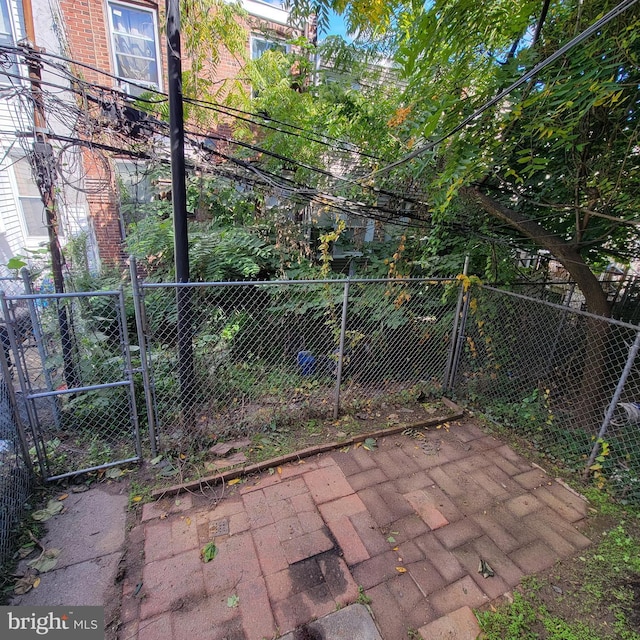 exterior space featuring a gate and fence