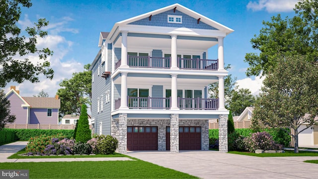 view of front of home featuring a garage and a balcony