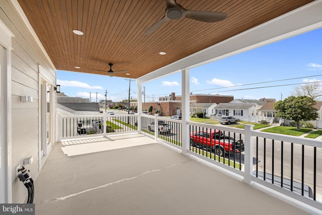 balcony with ceiling fan and a residential view