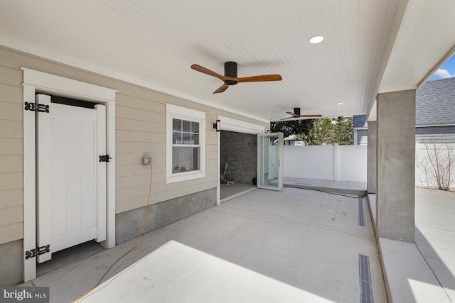 view of patio featuring a ceiling fan and fence