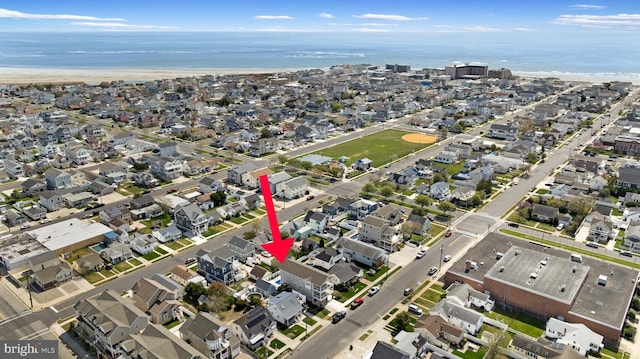 bird's eye view with a residential view and a water view