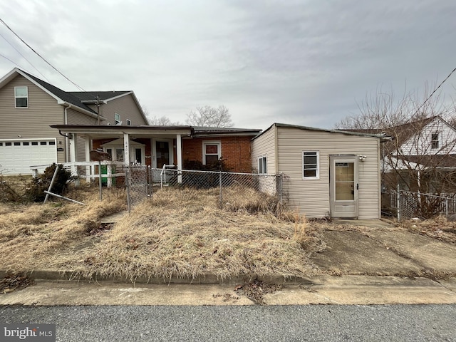 view of front of home with a garage and covered porch