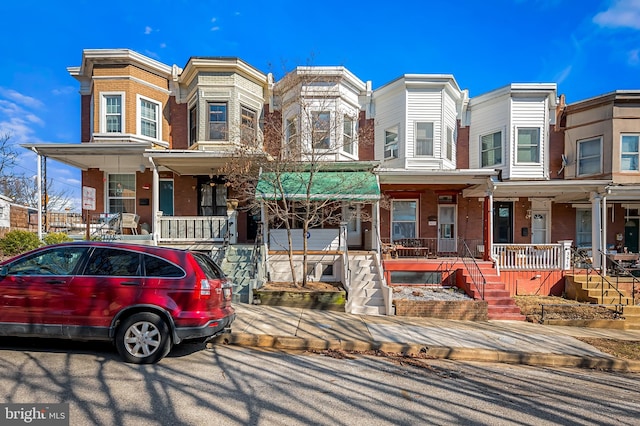 multi unit property featuring a porch