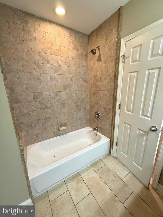 bathroom with tile patterned flooring and tiled shower / bath combo