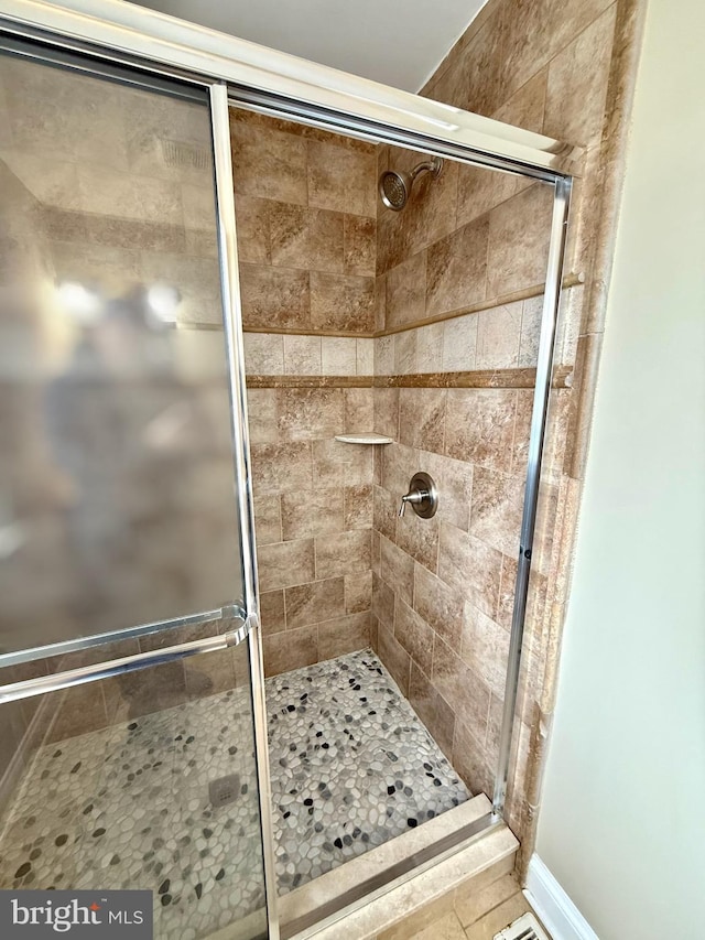 bathroom featuring an enclosed shower