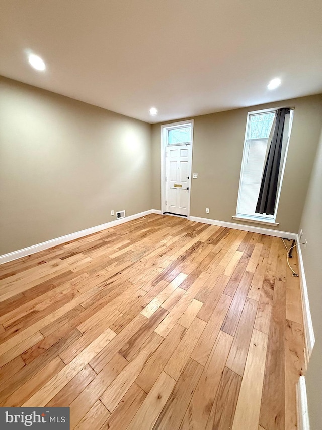 unfurnished room featuring light hardwood / wood-style flooring