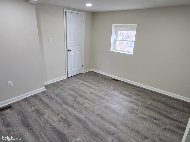 spare room featuring hardwood / wood-style floors