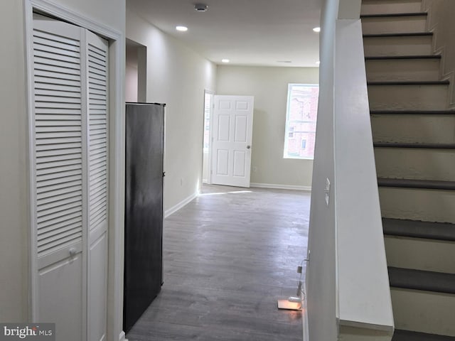 corridor with wood-type flooring