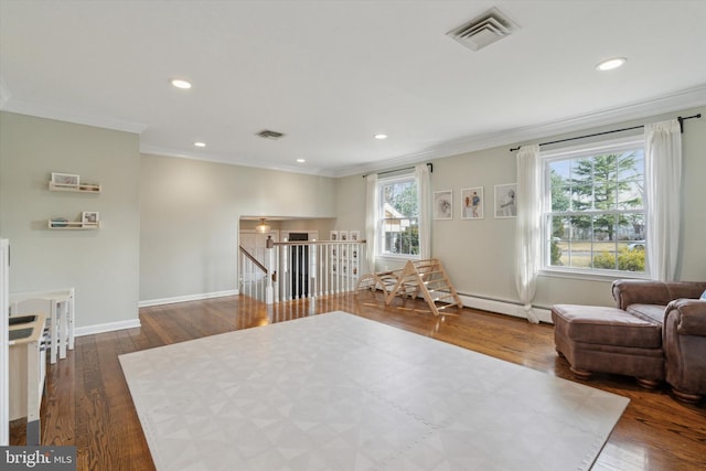 sitting room with crown molding, a baseboard radiator, and dark hardwood / wood-style floors