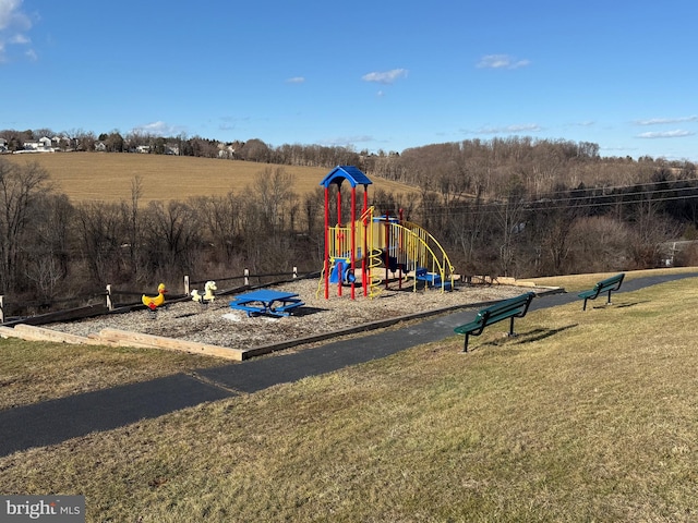 view of jungle gym with a lawn