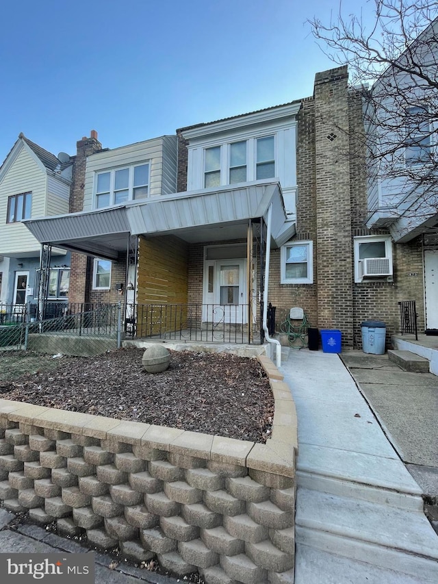 view of front of home featuring cooling unit and covered porch