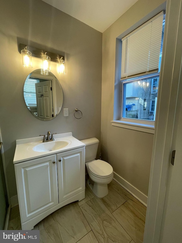 bathroom with vanity and toilet