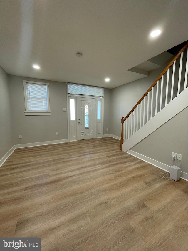 foyer with light hardwood / wood-style floors