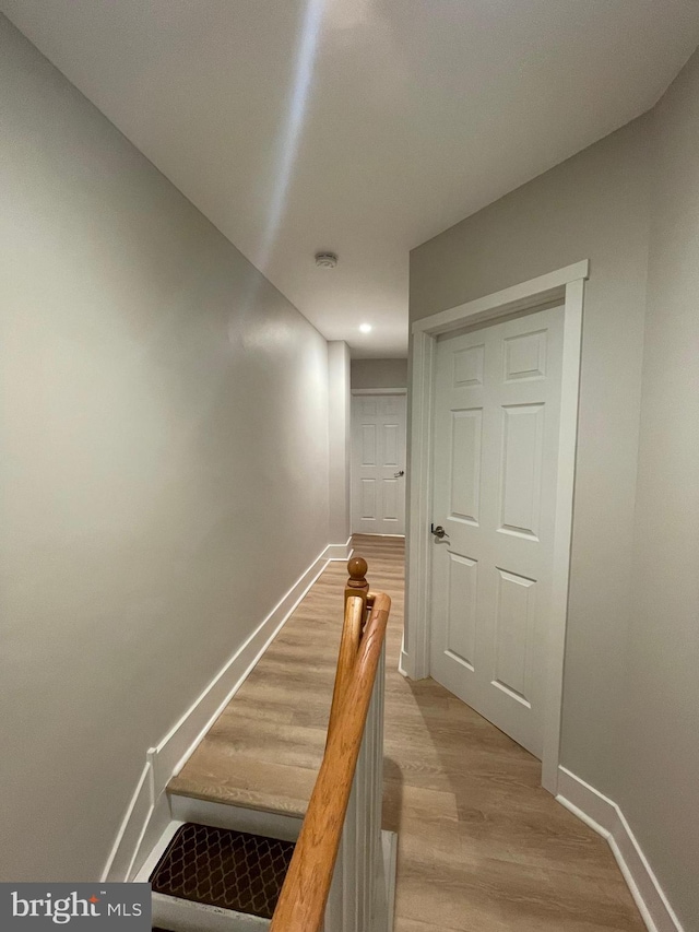 stairs with wood-type flooring