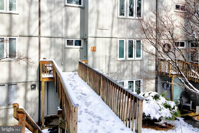 view of snow covered property entrance