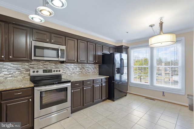 kitchen with appliances with stainless steel finishes, ornamental molding, dark brown cabinetry, and tasteful backsplash