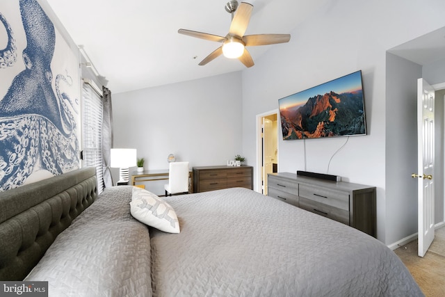 bedroom featuring carpet, vaulted ceiling, baseboards, and ceiling fan