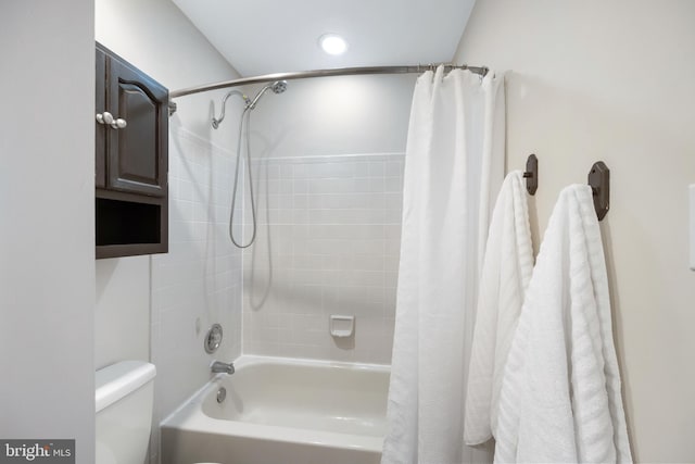 full bath with toilet and shower / bath combo