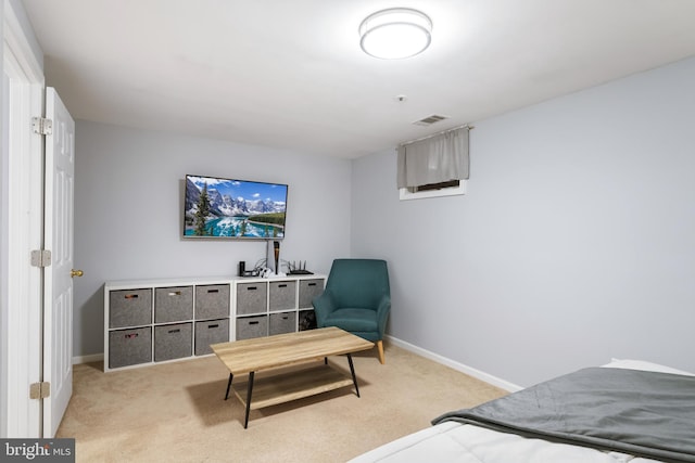 bedroom with light carpet, visible vents, and baseboards